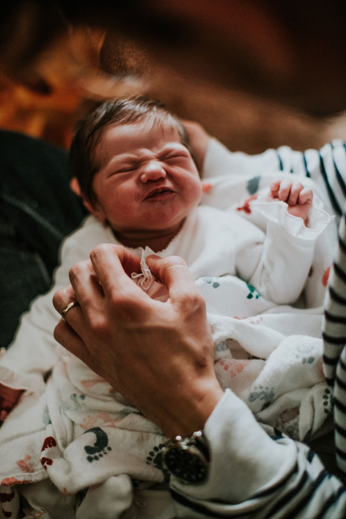 Crying Colic Baby being held